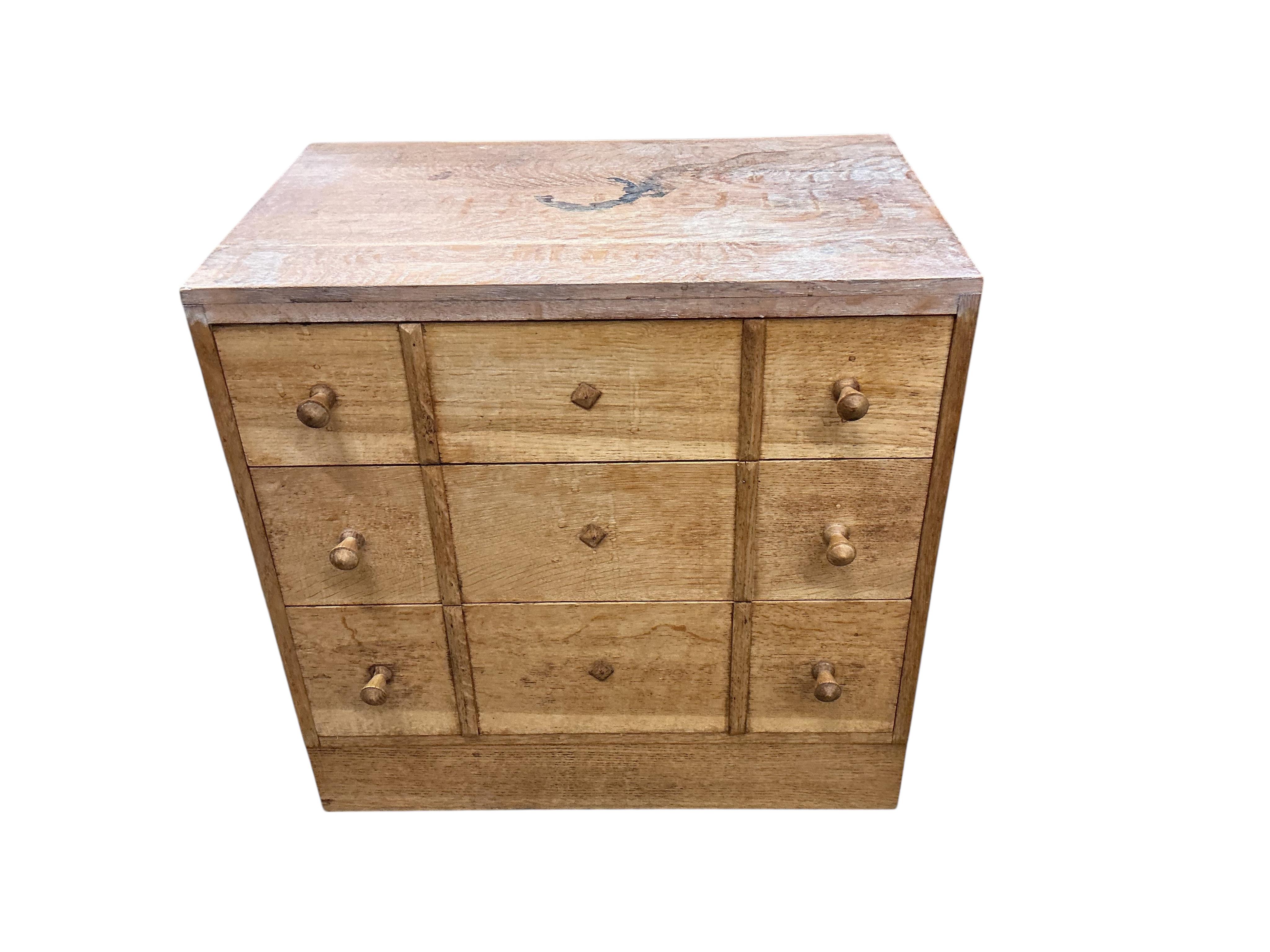 A pair of small limed oak three drawer chests in the manner of Heals, width 68cm, depth 43cm, height 68cm